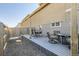 Relaxing backyard deck with furniture, privacy, and pea gravel at 202 Ash St, Bennett, CO 80102