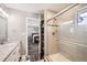 Bathroom view showcasing a glass-enclosed shower with shower head, and vanity at 202 Ash St, Bennett, CO 80102
