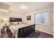 Cozy bedroom with a large window and ample natural light at 202 Ash St, Bennett, CO 80102