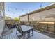 View of backyard deck with patio furniture and string lights at 202 Ash St, Bennett, CO 80102