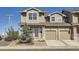 Charming two-story townhome featuring a private porch and a one car garage in a well-maintained community at 202 Ash St, Bennett, CO 80102