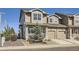 Charming two-story townhome featuring a private porch and a one car garage in a well-maintained community at 202 Ash St, Bennett, CO 80102