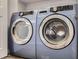 Front loading Samsung washer and dryer set in well lit laundry room at 202 Ash St, Bennett, CO 80102