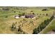 Aerial view of the property showcasing the home, land, and surrounding landscape at 34771 E 153Rd Ct, Hudson, CO 80642