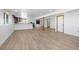 Spacious basement featuring modern flooring, several windows, and recessed lighting at 34771 E 153Rd Ct, Hudson, CO 80642