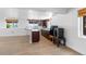 Basement with wood look floors, several windows, and a kitchenette at 34771 E 153Rd Ct, Hudson, CO 80642