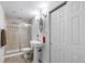 Bathroom with shower, pedestal sink, tile flooring and modern lighting at 34771 E 153Rd Ct, Hudson, CO 80642