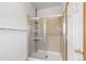 Bathroom shower featuring a sliding glass door, tile surround, and shower head at 34771 E 153Rd Ct, Hudson, CO 80642