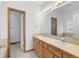 Bathroom with a double sink vanity, mirror, and white walls at 34771 E 153Rd Ct, Hudson, CO 80642