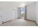 Bright bedroom with a large window and neutral decor at 34771 E 153Rd Ct, Hudson, CO 80642