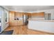 Modern kitchen with light oak cabinets, stainless steel appliances, and hardwood floors at 34771 E 153Rd Ct, Hudson, CO 80642