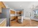 Bright kitchen with oak cabinets, stainless appliances, and an open layout to the living space at 34771 E 153Rd Ct, Hudson, CO 80642