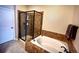 Relaxing bathroom with soaking tub and walk-in shower at 6945 Fargo Trl, Littleton, CO 80125