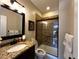 Clean bathroom with single vanity and shower/tub combo at 6945 Fargo Trl, Littleton, CO 80125