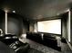 Home theater with black leather seating and large projection screen at 6945 Fargo Trl, Littleton, CO 80125