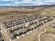Stunning aerial view of a well-planned community nestled against a backdrop of rolling hills and mountains at 18984 W 85Th Blf, Arvada, CO 80007