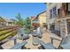 Charming backyard featuring comfortable seating around a stone fire pit at 18984 W 85Th Blf, Arvada, CO 80007