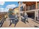 Inviting backyard patio features a stone fire pit and Adirondack chairs, perfect for outdoor relaxation at 18984 W 85Th Blf, Arvada, CO 80007