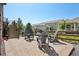 Charming backyard with pavers and chairs around a stone firepit at 18984 W 85Th Blf, Arvada, CO 80007