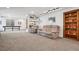 Finished basement with neutral carpet, recreational table, and comfortable seating area at 18984 W 85Th Blf, Arvada, CO 80007