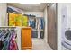 Walk-in closet featuring a sliding barn door and plenty of room to hang clothing at 18984 W 85Th Blf, Arvada, CO 80007