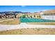 Community park with basketball court, playground, covered picnic area, and green space for outdoor activities at 18984 W 85Th Blf, Arvada, CO 80007