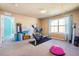Versatile space for an exercise room, complete with equipment and natural light at 18984 W 85Th Blf, Arvada, CO 80007