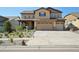 Charming two-story home featuring a three-car garage and well-maintained landscaping at 18984 W 85Th Blf, Arvada, CO 80007