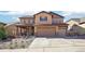 Charming two-story home with a three-car garage and covered porch at 18984 W 85Th Blf, Arvada, CO 80007