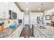 Spacious kitchen featuring stainless steel appliances, and sleek white cabinetry at 18984 W 85Th Blf, Arvada, CO 80007
