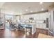 Modern kitchen with white cabinets, granite countertops, and a center island at 18984 W 85Th Blf, Arvada, CO 80007