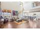 Spacious living room with hardwood floors, tall ceilings, and lots of natural light at 18984 W 85Th Blf, Arvada, CO 80007