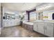 Main bathroom with double sinks, a soaking tub and plenty of storage at 18984 W 85Th Blf, Arvada, CO 80007