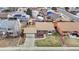 Aerial shot features a charming home with a well-maintained front yard and mature landscaping at 412 N 10Th Ave, Brighton, CO 80601