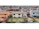 A bird's-eye view of a cozy neighborhood with well-maintained lawns and colorful houses at 412 N 10Th Ave, Brighton, CO 80601