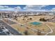 Aerial view of a park with playing fields, green spaces, parking, and walking paths at 412 N 10Th Ave, Brighton, CO 80601