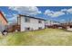 Spacious backyard featuring a well-maintained lawn and privacy fence at 412 N 10Th Ave, Brighton, CO 80601