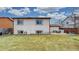 Wide backyard with a patio area, ideal for outdoor entertaining and relaxation at 412 N 10Th Ave, Brighton, CO 80601