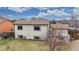 Aerial view of backyard with a well-kept lawn and patio set at 412 N 10Th Ave, Brighton, CO 80601