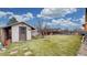 Backyard featuring a shed and a lush lawn at 412 N 10Th Ave, Brighton, CO 80601