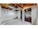 Spacious unfinished basement features exposed ceiling, an open closet, and concrete flooring at 412 N 10Th Ave, Brighton, CO 80601