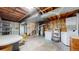 Large unfinished basement with washer, dryer, exposed ceiling, and table with chairs at 412 N 10Th Ave, Brighton, CO 80601