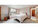 A cozy bedroom with a plush bed, soft window treatments, and warm lighting for a relaxing ambiance at 412 N 10Th Ave, Brighton, CO 80601