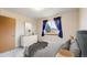 Cozy bedroom features white dresser and serene decor at 412 N 10Th Ave, Brighton, CO 80601