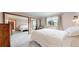 A bright bedroom features mirrored closet doors that reflect the light throughout the room at 412 N 10Th Ave, Brighton, CO 80601