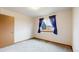 Vacant bedroom with soft carpet and window with curtains at 412 N 10Th Ave, Brighton, CO 80601