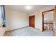 This bedroom boasts neutral walls, soft gray carpeting, and a closet for ample storage at 412 N 10Th Ave, Brighton, CO 80601