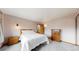 Comfortable bedroom featuring a queen-sized bed, a nightstand, and wooden dresser, creating a calming retreat at 412 N 10Th Ave, Brighton, CO 80601
