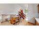 Open kitchen with granite-topped island and stairs to upper floor at 412 N 10Th Ave, Brighton, CO 80601