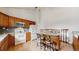 Kitchen featuring a peninsula island with bar stool seating, stainless steel appliances, and wood cabinets at 412 N 10Th Ave, Brighton, CO 80601